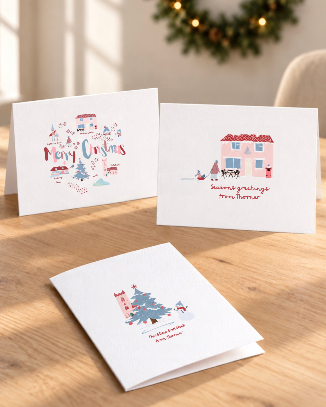 Three Thorner Christmas cards by Yorkshire artist Ella Cairns: Merry Christmas village map, Seasons greetings and Christmas wishes